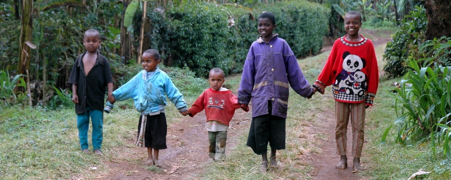 Image of five young children in Africa holding hands