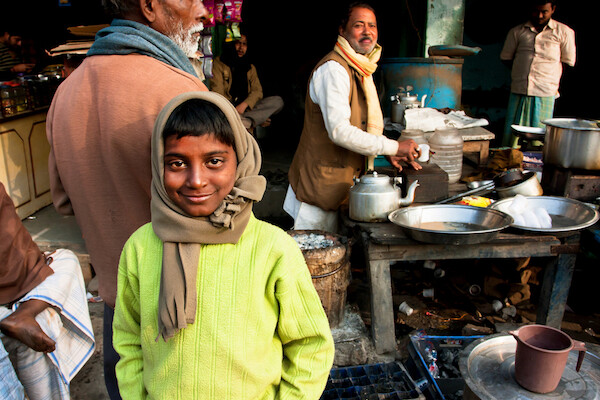 Boy in outdoor Indian cafe