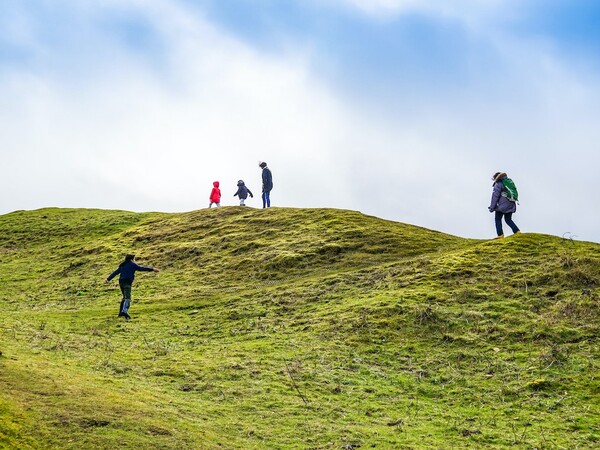 people on a hill