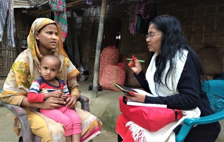 A woman being interviewed by a woman