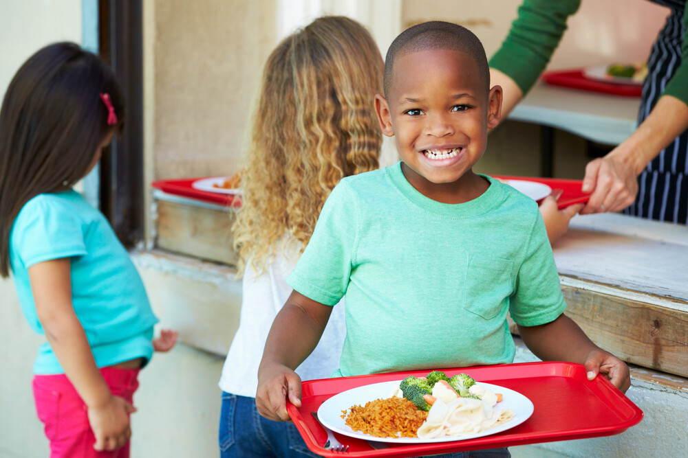 kid with food tray